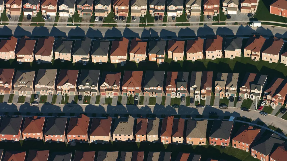 Aerial view of older suburban houses with cement roofing